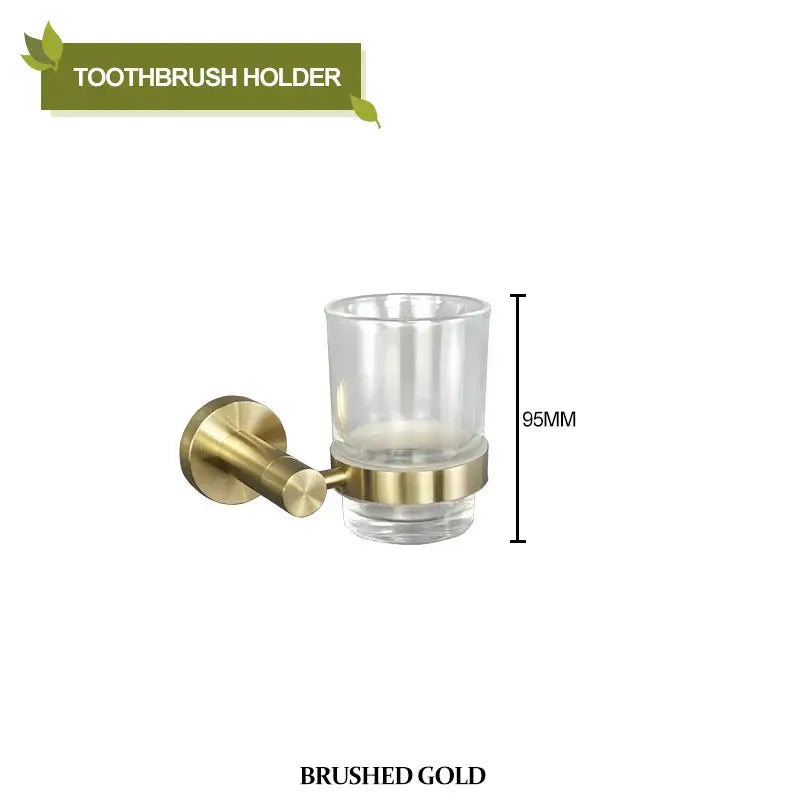 Brushed gold bathroom pendant set featuring a toothbrush holder with clear glass cup and metallic mounting bracket decorbites brushed gold