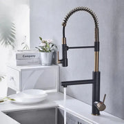 Black and brushed gold kitchen faucet with flexible coiled spring spout from decorbites brushed gold collection