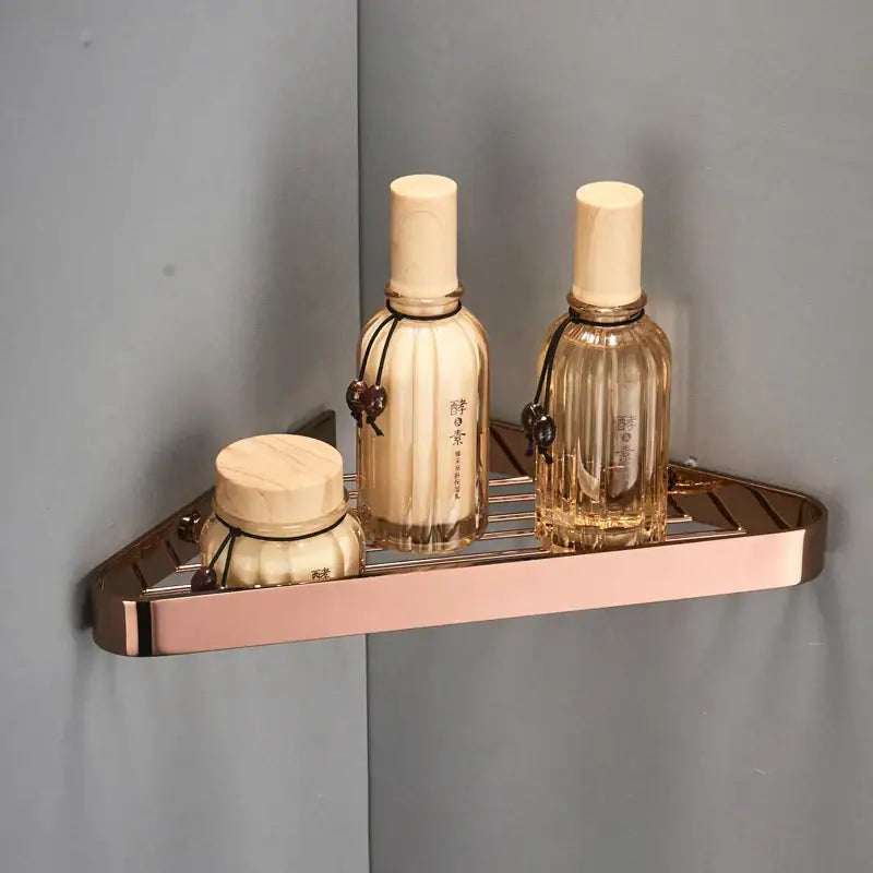 Rose gold brass bathroom shower rack with hooks and a sleek grid metal surface for corner storage decorbites brass bathroom