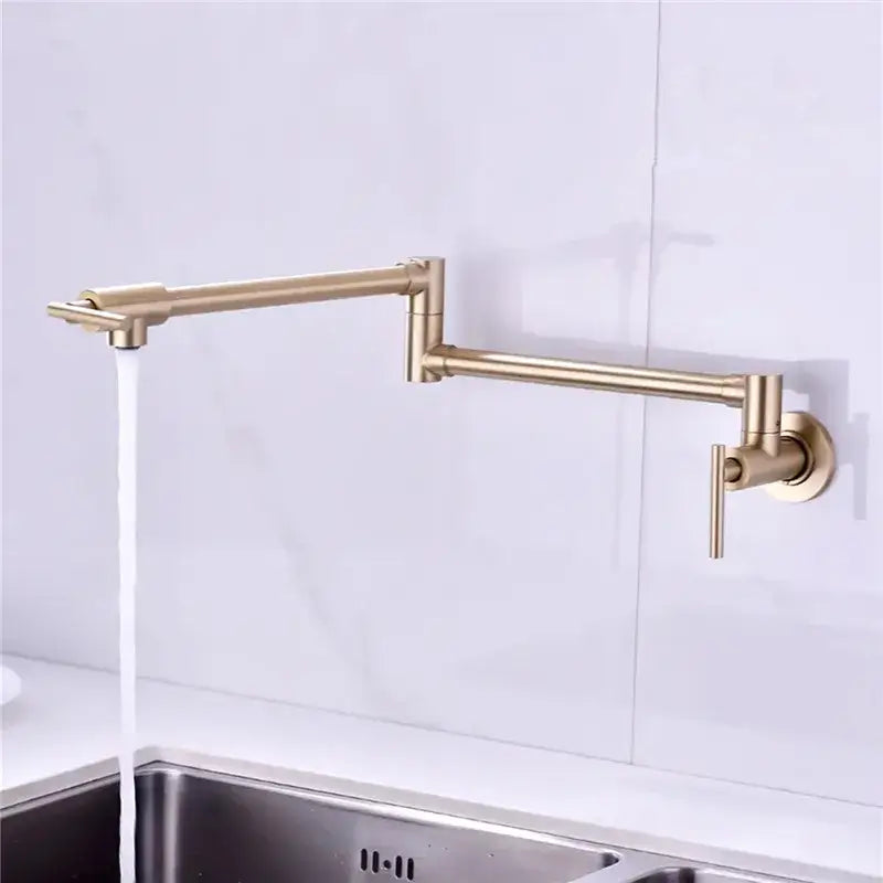 Brushed gold foldable pot filler faucet with extendable articulated arm and sleek metallic finish for kitchen wall mount