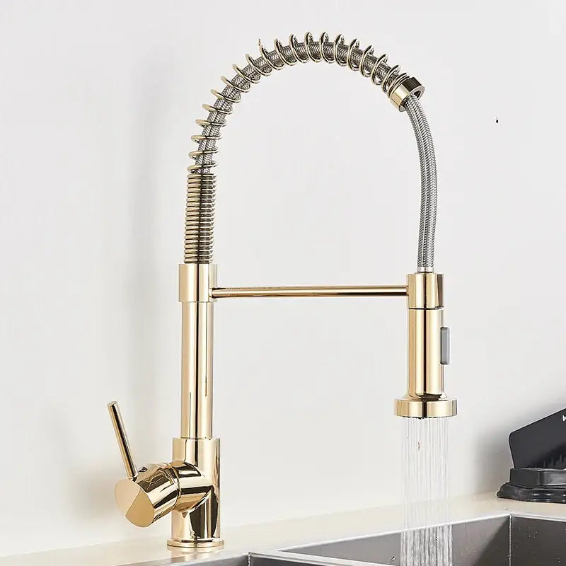 Brushed gold kitchen faucet with flexible coiled spring hose and sleek metallic finish for modern kitchen use
