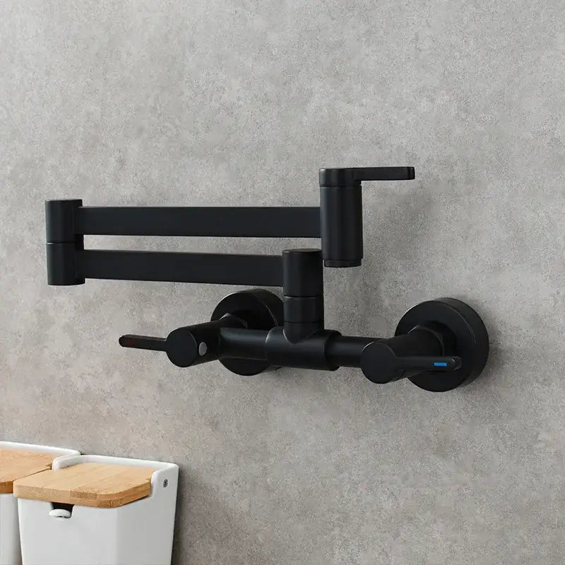 Black matte kitchen faucet with dual handles and extendable foldable spout in brushed gold finish for modern kitchens