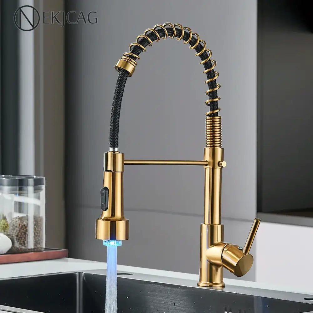 Brushed gold led kitchen faucet with black spring pull down hose and blue led lighting at the spout decorbites brushed gold