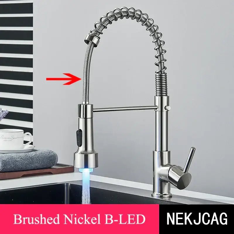 Brushed gold led kitchen faucet with black spring pull down hose and a flexible brushed nickel coiled hose with blue led light