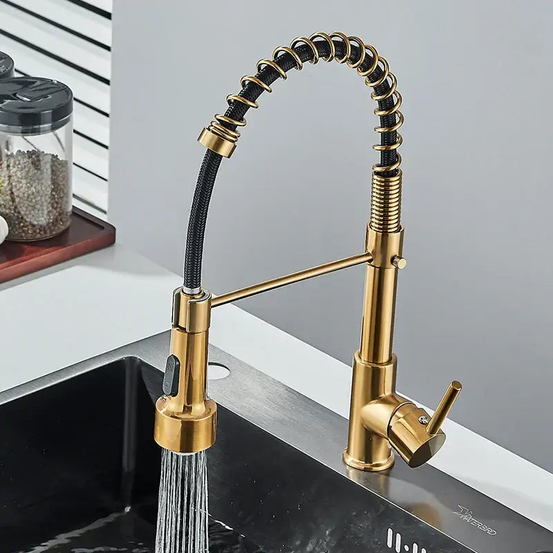 Brushed gold led kitchen faucet with black spring pull down hose featuring a flexible coiled design by decorbites
