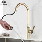 Brushed gold kitchen faucet with sleek curved spout and pull out spray head by decorbites brushed gold