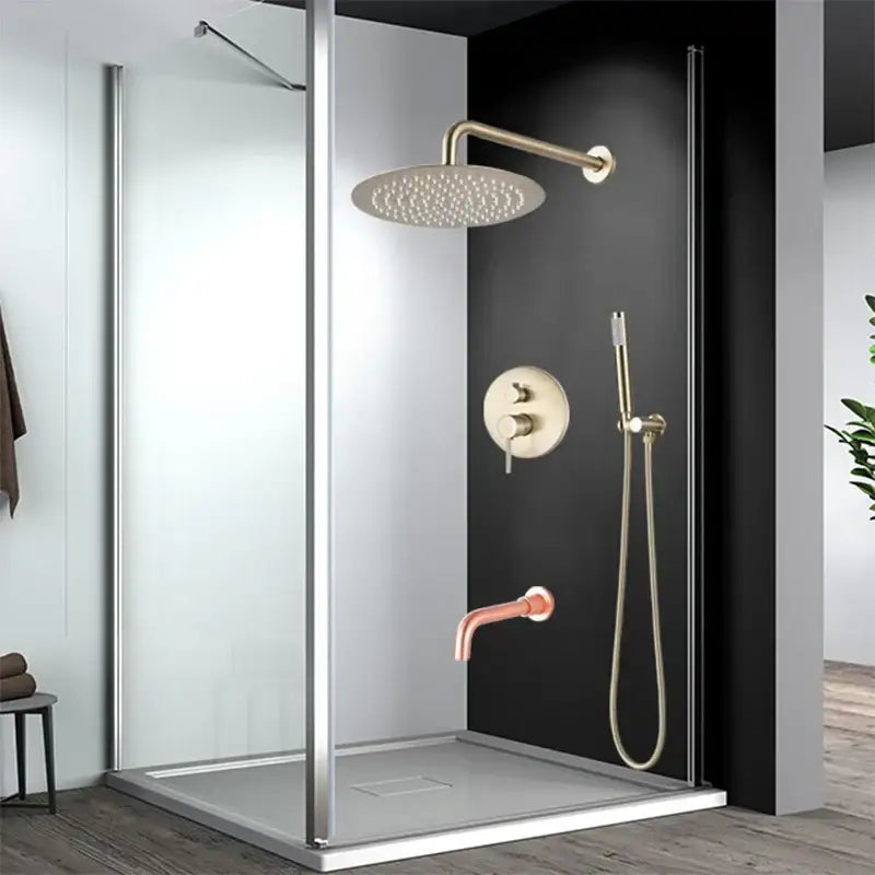 Brushed gold rainfall shower faucet set with modern circular showerhead and adjustable arm in a sleek glass enclosure