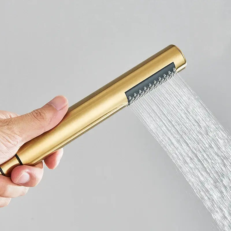 Brushed gold round hand shower with sleek design and water jets by decorbites for modern bathroom use
