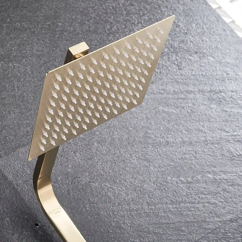 Brushed gold shower mixer with rainfall head and handheld spray featuring a gold-toned square diamond-patterned showerhead decorbites brushed gold