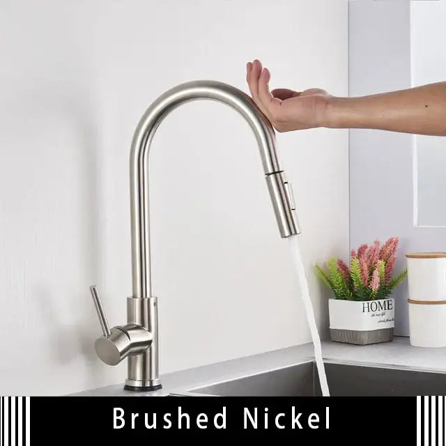 Brushed nickel kitchen faucet with sleek arched spout and pull-down spray head for smart touch kitchen use