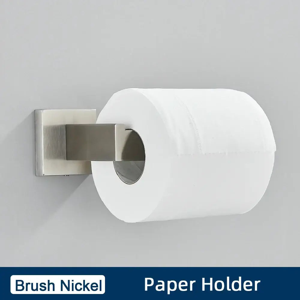 Brushed gold bathroom accessories set featuring a brush nickel toilet paper holder with a sleek modern design holding a white roll