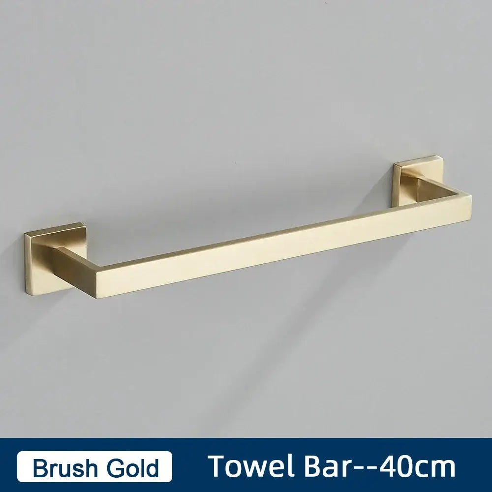 Brushed gold stainless steel bathroom accessories set featuring a towel bar with modern square mounting plates