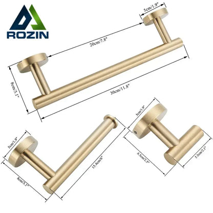 Brushed gold stainless steel towel rack with cylindrical handles in a sleek bathroom accessories set