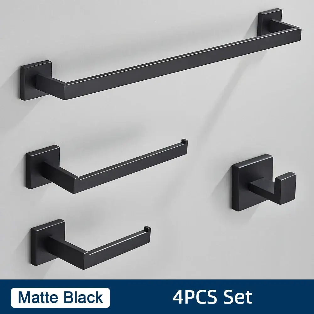 Matte black bathroom towel rack and hook set made of stainless steel contrasting a brushed gold bathroom accessories set