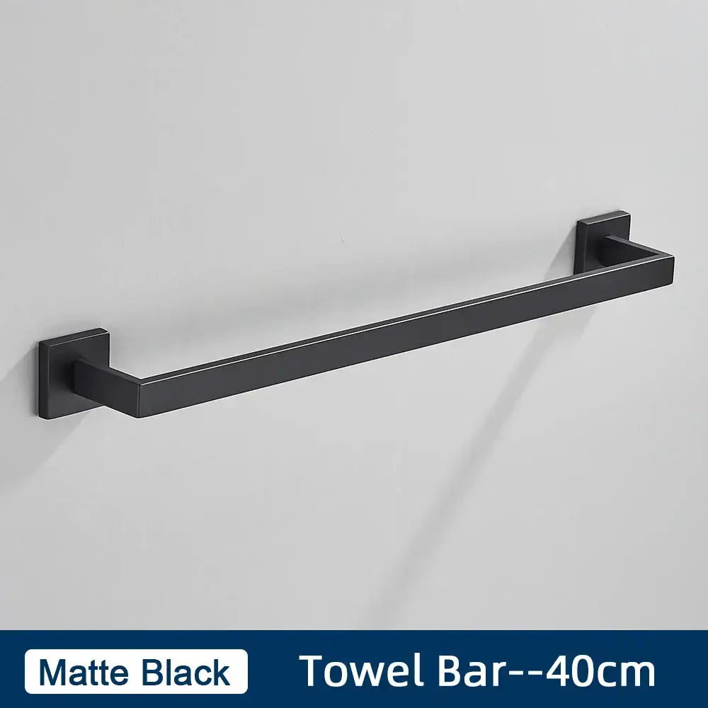 Matte black metal towel bar with sleek modern design included in brushed gold stainless steel bathroom accessories set