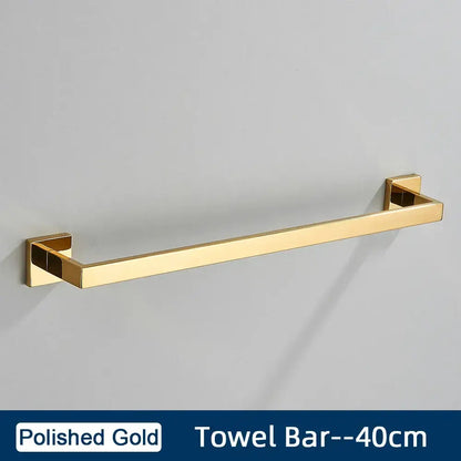 Polished gold towel bar with sleek rectangular design and square brackets in brushed gold stainless steel bathroom accessories set