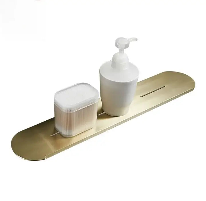 Brushed gold stainless steel bathroom storage rack with mirror front holding a white pump and cotton swabs in slots