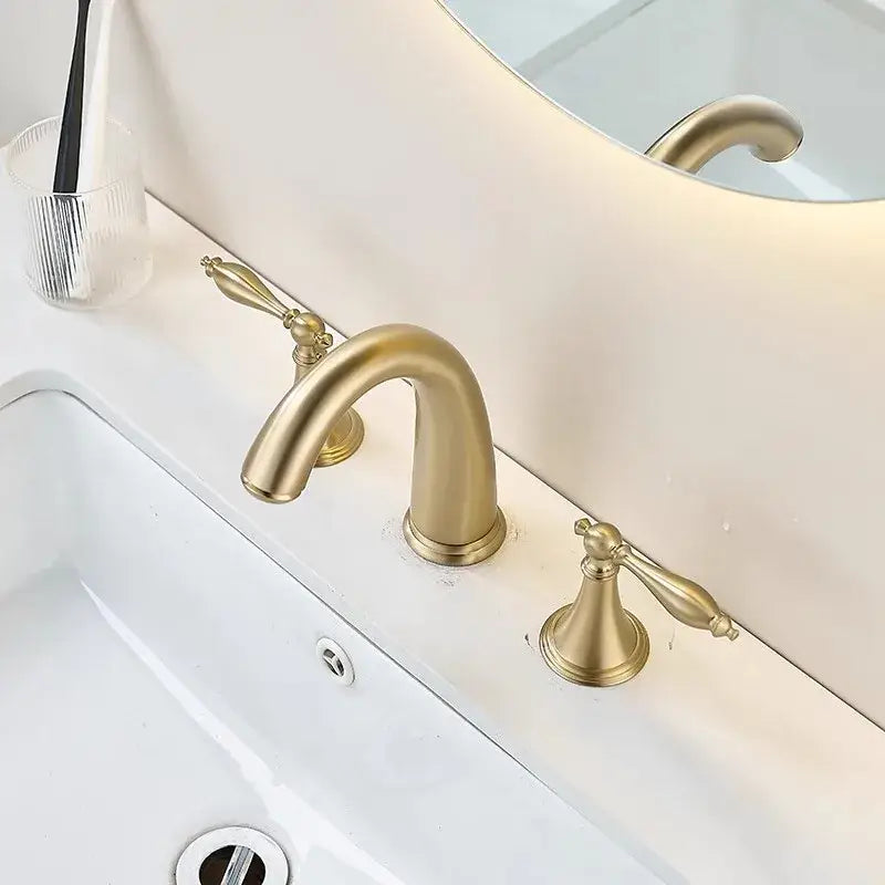 Brushed gold basin faucet with vintage ornate handles and curved spout by decorbites for bathroom sinks