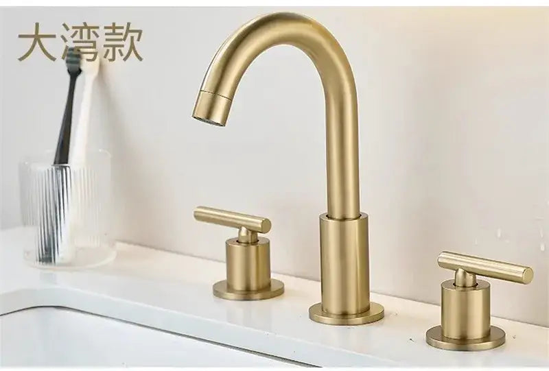 Brushed gold modern farmhouse basin faucet with sleek curved spout and cross-handle controls by decorbites brushed gold