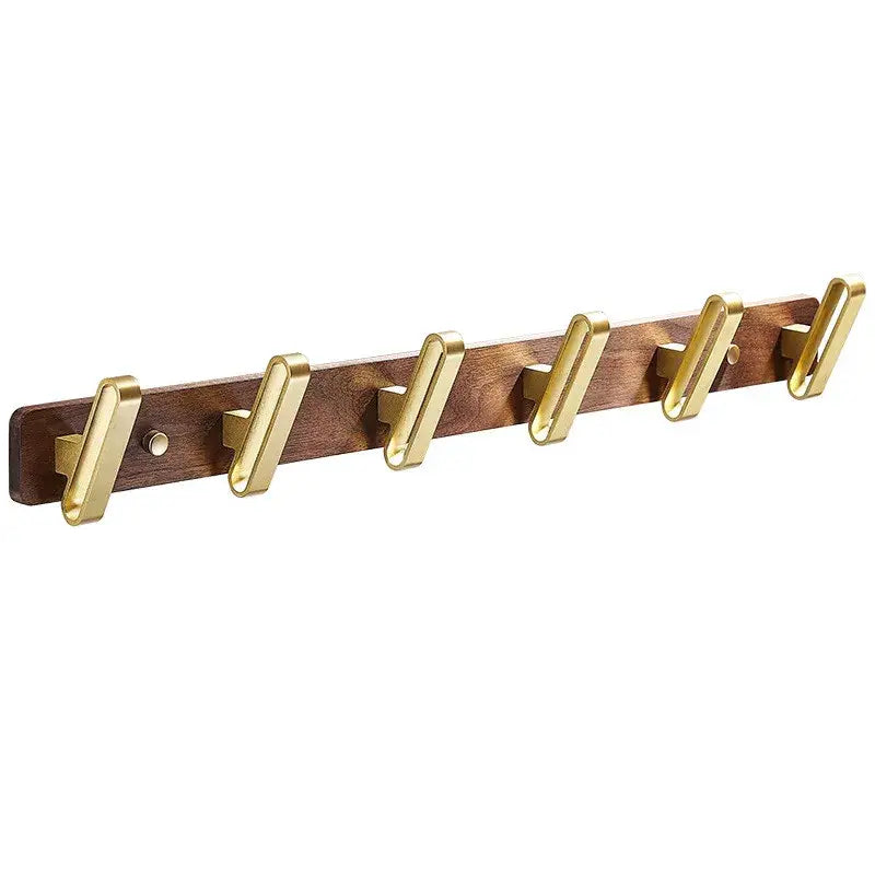 A sleek wooden robe hook towel hanger with five polished brass hooks for bathroom use