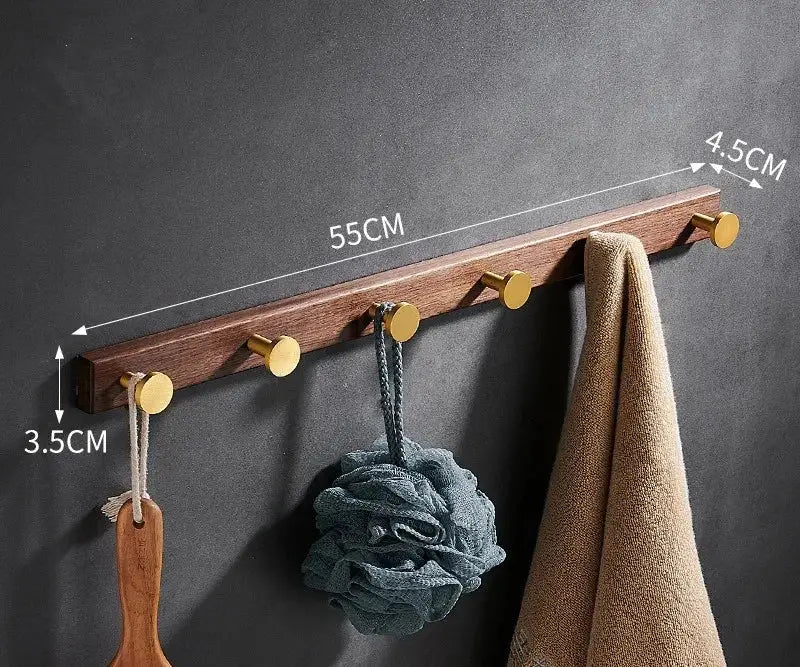 Brushed gold wood and aluminum robe hook towel hanger with five gold-toned hooks in natural wood finish