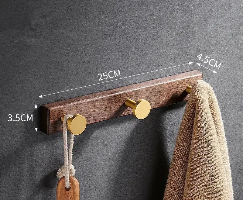 Brushed gold wood and aluminum robe hook towel hanger with three gold-toned circular hooks for bathroom use