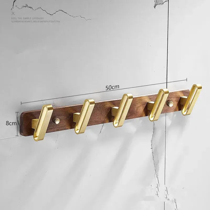 Brushed gold metal robe hook towel hanger with dark wood plank base 50cm long for bathroom use