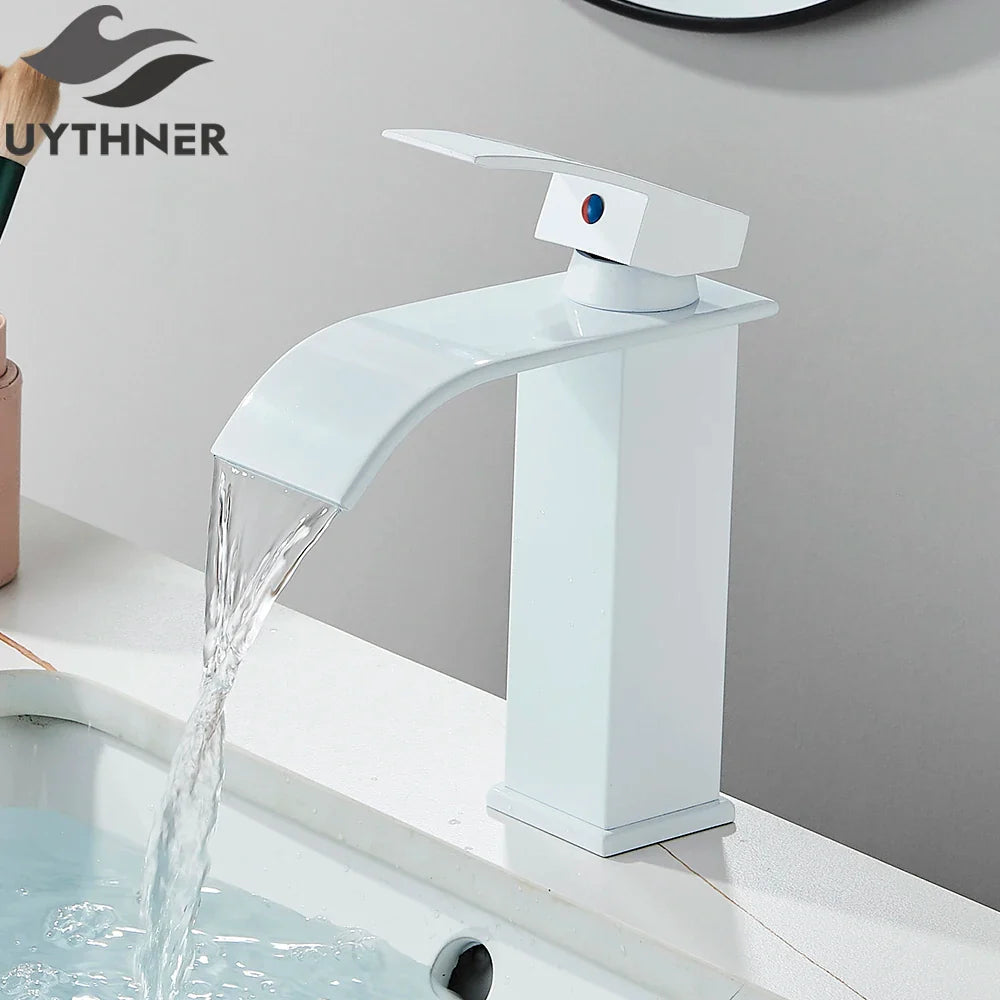Brushed golden single hole basin faucet with elegant waterfall design and glossy finish for modern bathroom sinks