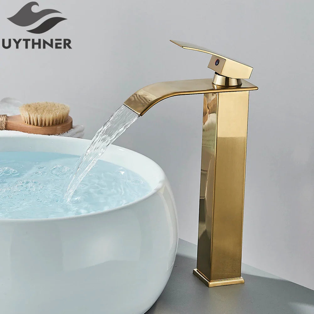 Brushed golden single hole basin faucet with modern rectangular waterfall design and brass mixer for bathroom sink deck mount