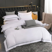 White satin-like duvet cover with elegant gray piping trim in decorbites brushed hotel style bedding sets