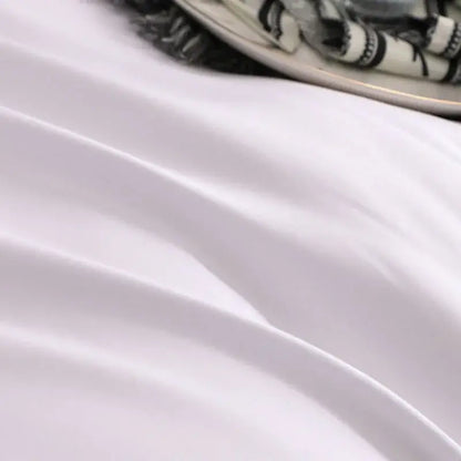 Soft white satin fabric with gentle folds and subtle sheen in decorbites brushed hotel style white gray bedding sets