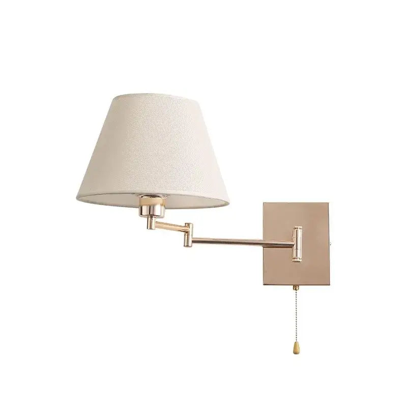 A sleek matte brass wall lamp with adjustable rocker arm and cream fabric shade for living room lighting