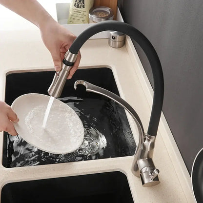 Brushed nickel and black kitchen sink faucet with flexible hose and pull down spray for versatile use
