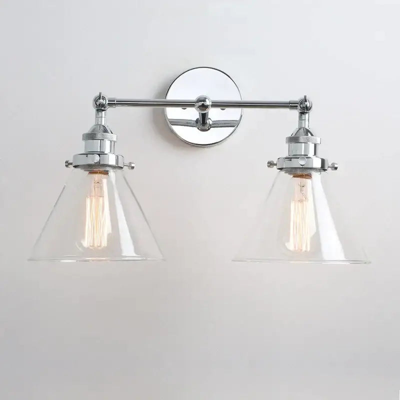 Chrome finished wall lamp with two clear funnel glass metal shades and exposed Edison bulbs for bedroom decorbites funnel glass