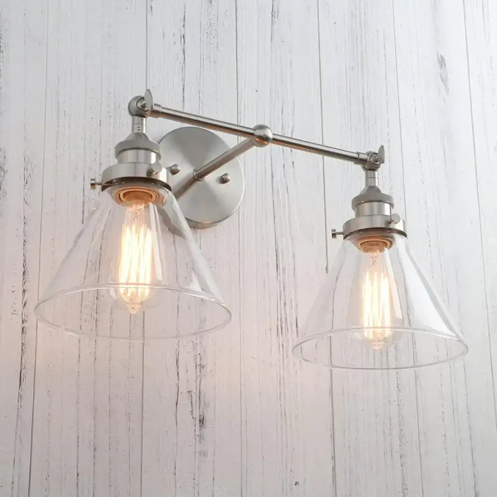 Brushed nickel wall lamp with two clear funnel glass metal shades and exposed filament bulbs for bedroom decorbites funnel glass