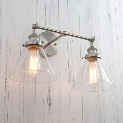 Brushed nickel wall lamp with two clear funnel glass metal shades and exposed filament bulbs for bedroom decorbites funnel glass