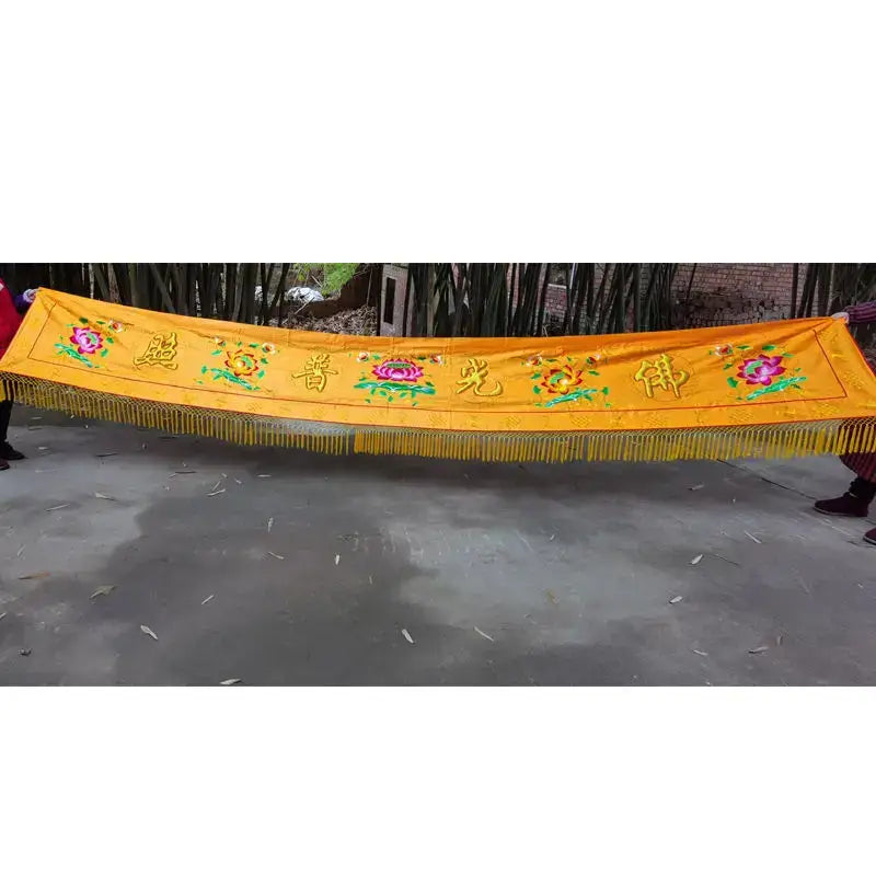 Vibrant yellow silk altar curtain with embroidered Chinese characters floral motifs and golden fringe for home temple decor