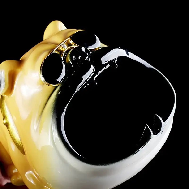 Golden ceramic ashtray shaped like a bulldog with glossy black mouth and eye accents sunglasses ceramic ashtray set