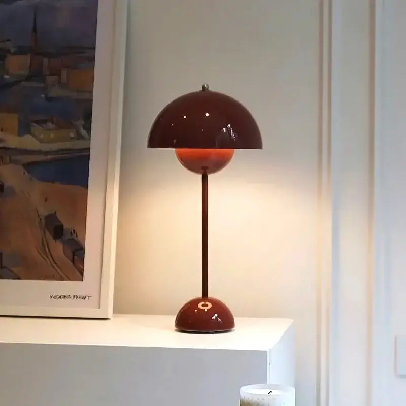 A glossy burgundy flower-shaped floor lamp with a minimalist design perfect for bedroom decorbites bud floor lamp