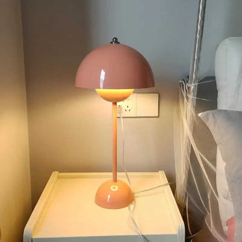 A sleek blush-pink ceramic decorbites bud floor lamp with a dome-shaped flower shade for bedroom use