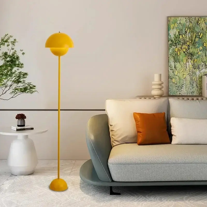 A vibrant yellow decorbites bud floor lamp with a sleek rounded dome shade and slender stem for bedroom decor