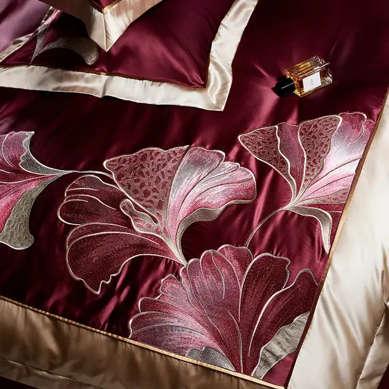 Deep burgundy satin bedspread with intricate silver and pink floral embroidery in egyptian cotton decorbites ginkgo biloba bedding set