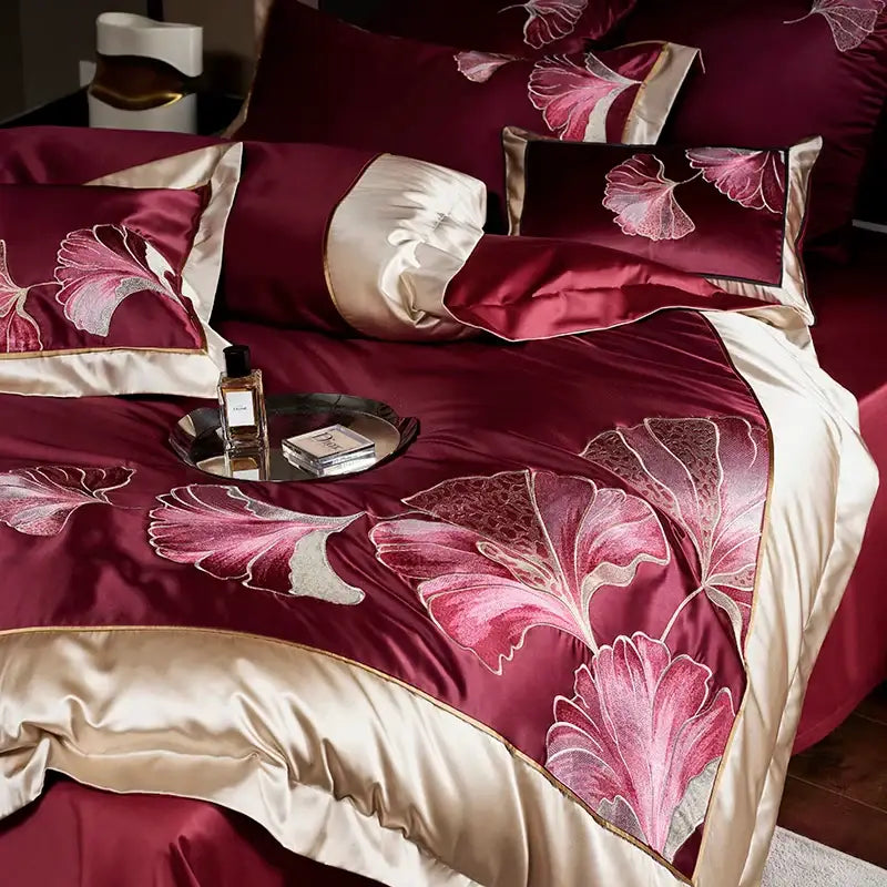 Elegant burgundy satin bedding set in egyptian cotton featuring pink cream ginkgo leaf embroidery by decorbites ginkgo biloba