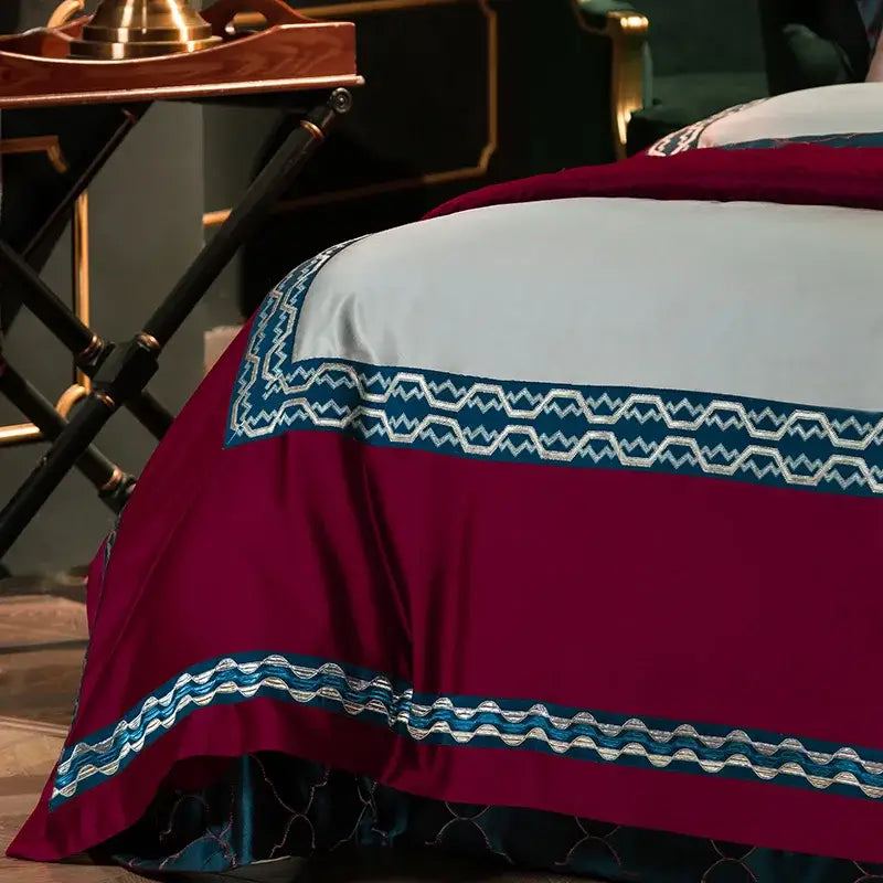 Burgundy and silver 200s egyptian cotton embroidery bedding set with elegant geometric design on bedspread edges