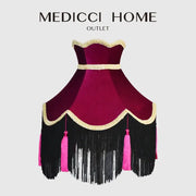 A burgundy wine red velvet scalloped lampshade with gold trim, black fringe, and pink tassels for living room use