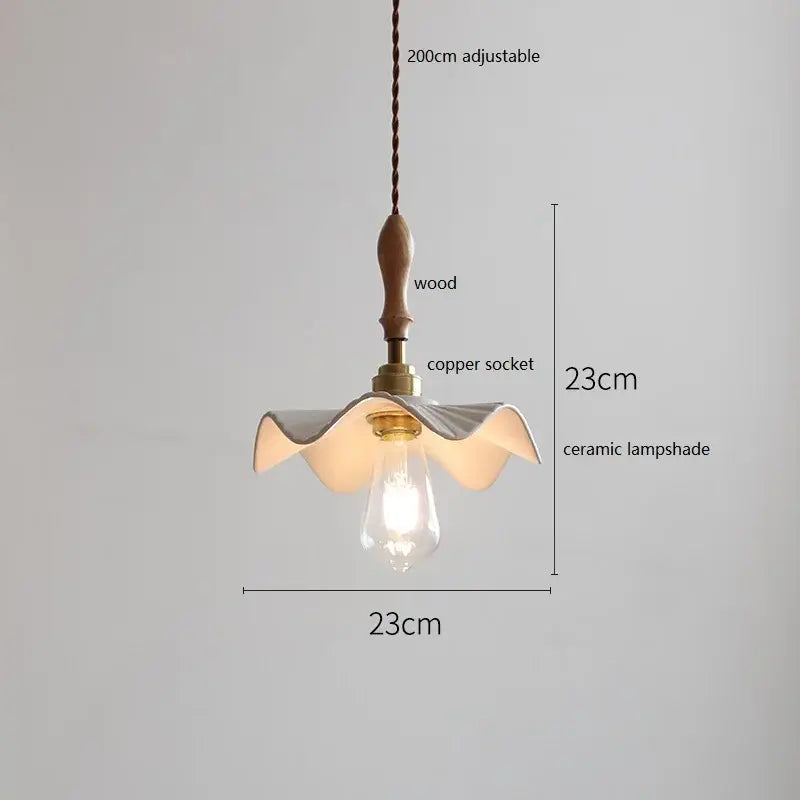 Butterfly ceramic led pendant lamp with white fluted ceramic shade hanging from wooden fixture and copper socket