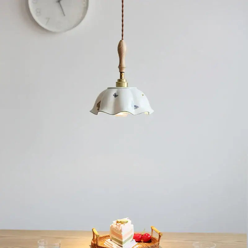 A white fluted ceramic pendant lamp with black butterfly motifs and wooden handle for bedroom decorbites butterfly ceramic led