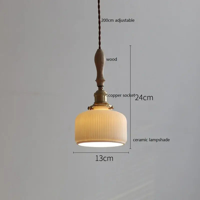 A warm-toned butterfly ceramic led pendant lamp with vertical ridges, wooden handle, and copper socket for bedroom decorbites butterfly ceramic light