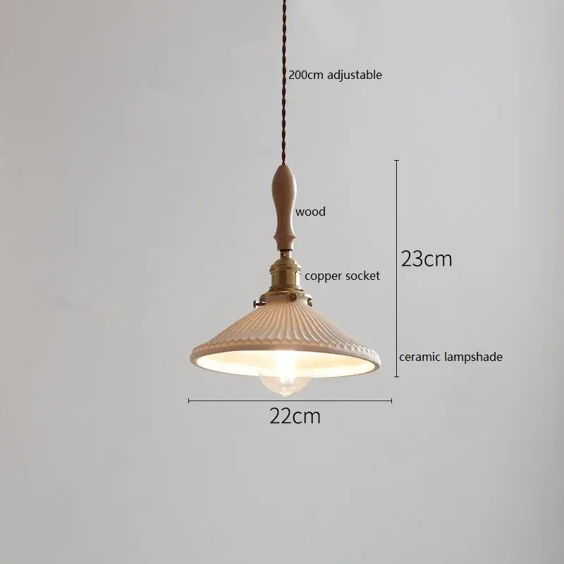 A warm-toned white fluted ceramic pendant lamp with a wooden finial and copper socket by decorbites butterfly ceramic