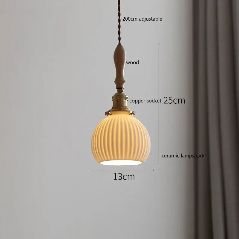 A warm-toned butterfly ceramic led pendant lamp with vertical ridges, wooden handle, and copper socket for bedroom decor